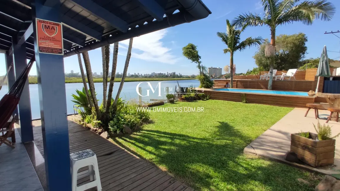 Foto 2 de Casa com 5 quartos à venda, 162m2 em Torres - RS