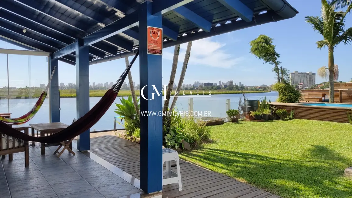 Foto 5 de Casa com 5 quartos à venda, 162m2 em Torres - RS