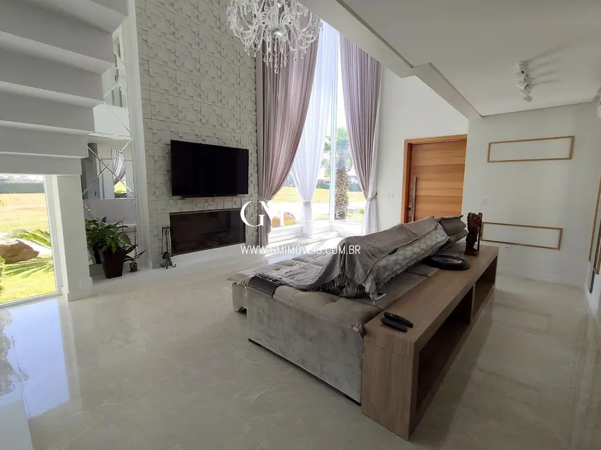 Foto 1 de Casa de Condomínio com 4 quartos à venda, 377m2 em Torres - RS