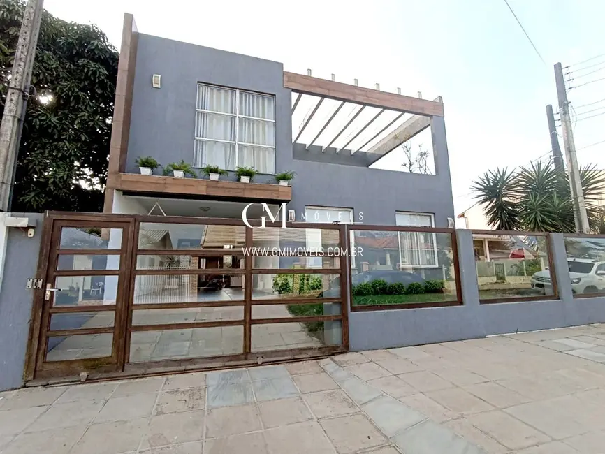 Foto 1 de Casa com 5 quartos à venda, 265m2 em Torres - RS