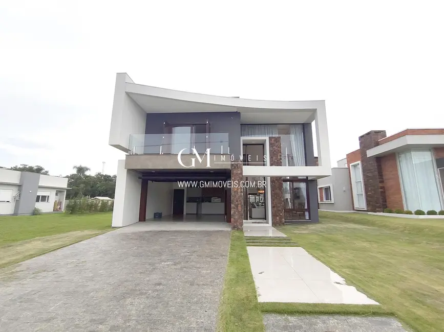 Foto 2 de Casa de Condomínio com 4 quartos à venda, 310m2 em Torres - RS