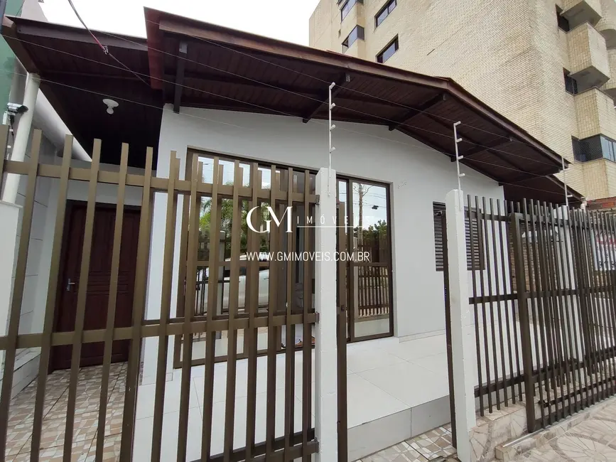 Foto 1 de Casa com 3 quartos à venda, 77m2 em Torres - RS