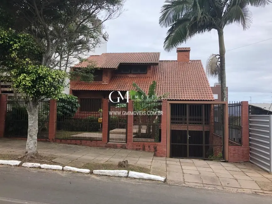 Foto 1 de Casa com 9 quartos à venda, 386m2 em Torres - RS