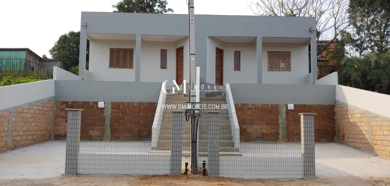 Foto 1 de Casa com 2 quartos à venda, 66m2 em Torres - RS