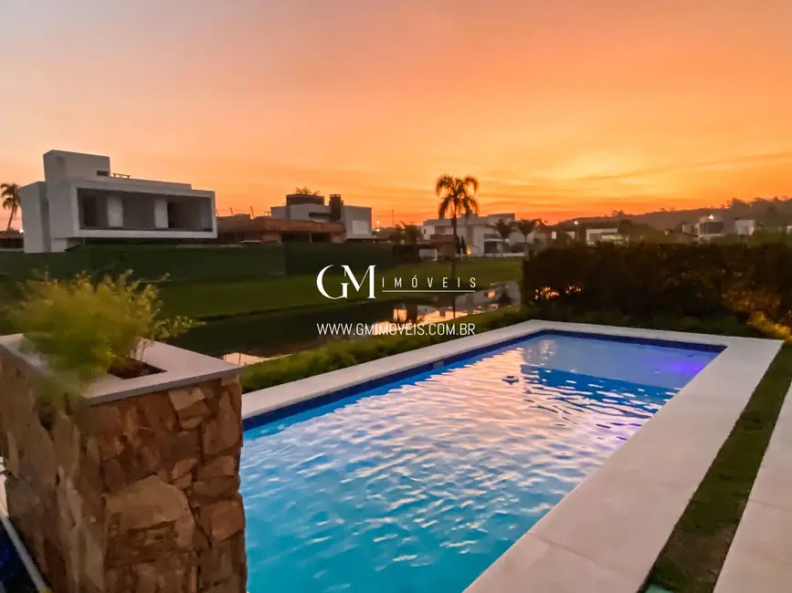 Casa de Condomínio com 4 quartos à venda, 339m2 em Torres - RS - imagem 2 Foto 2 de Casa de Condomínio com 4 quartos à venda, 339m2 em Torres - RS