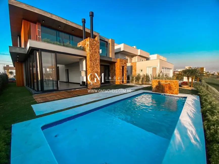 Casa de Condomínio com 4 quartos à venda, 339m2 em Torres - RS - imagem 3 Foto 3 de Casa de Condomínio com 4 quartos à venda, 339m2 em Torres - RS