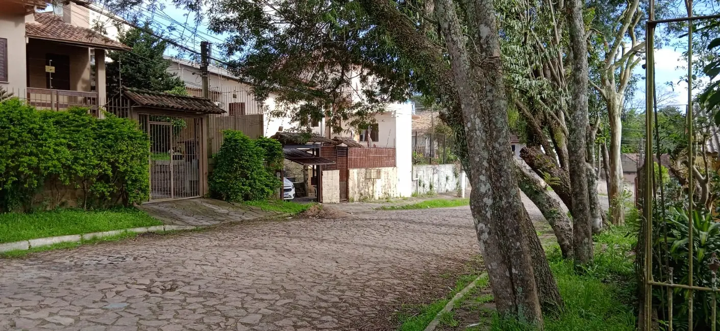 Casas com área de serviço à venda em Santa Cecilia, Viamão, RS - ZAP Imóveis