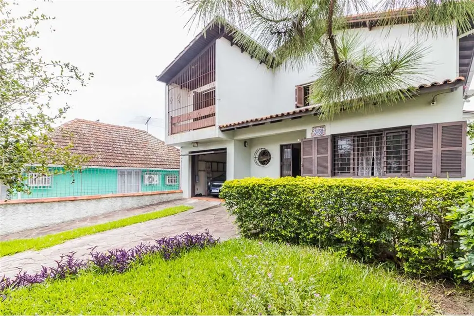 Foto 1 de Casa com 4 quartos à venda, 313m2 em Cavalhada, Porto Alegre - RS