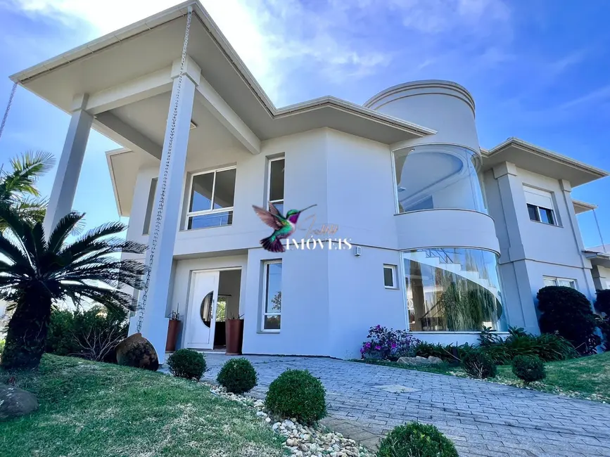Foto 1 de Casa com 4 quartos à venda, 390m2 em Capao Da Canoa - RS