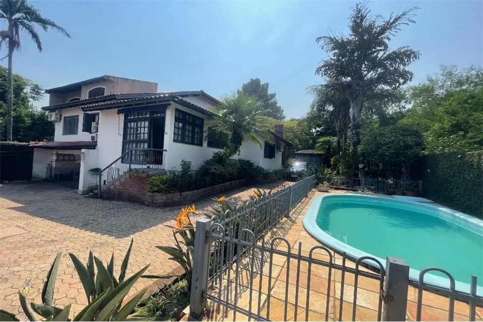 Foto 1 de Casa com 4 quartos à venda, 525m2 em Jardim Sabará, Porto Alegre - RS