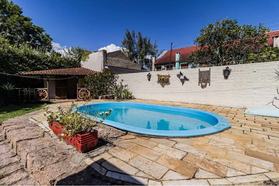 Casa com 3 quartos à venda, 235m2 em Guarujá, Porto Alegre - RS - imagem 9 Foto 9 de Casa com 3 quartos à venda, 235m2 em Guarujá, Porto Alegre - RS