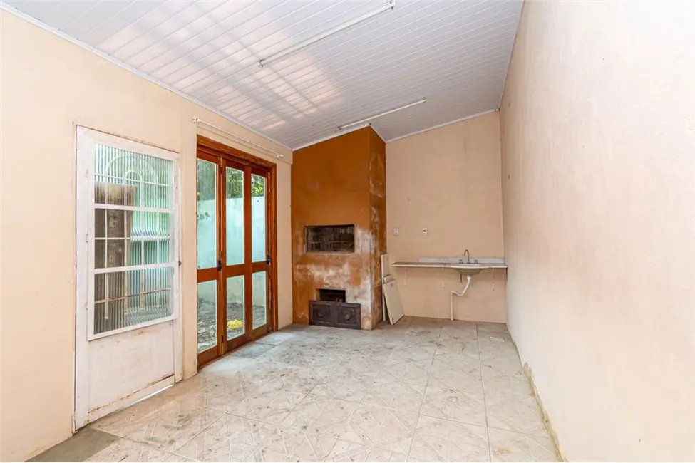Casa com 4 quartos à venda, 113m2 em Harmonia, Canoas - RS - imagem 5 Foto 5 de Casa com 4 quartos à venda, 113m2 em Harmonia, Canoas - RS
