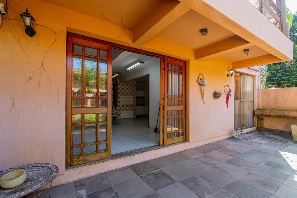Foto 2 de Casa com 6 quartos à venda, 376m2 em Tristeza, Porto Alegre - RS