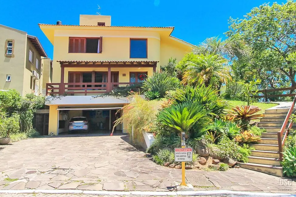 Foto 1 de Casa de Condomínio com 3 quartos à venda, 389m2 em Vila Nova, Porto Alegre - RS