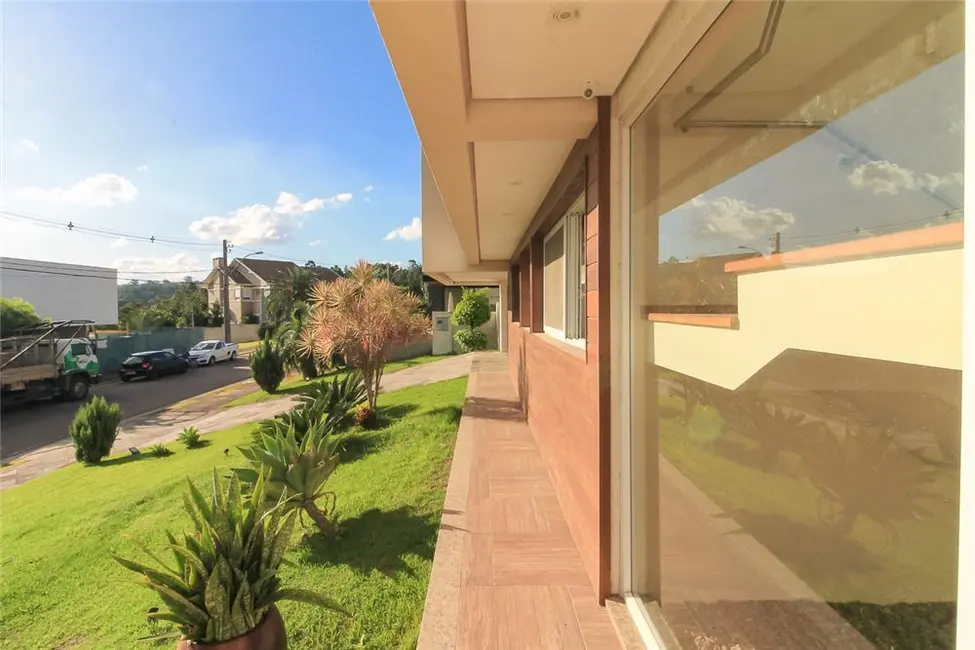 Foto 7 de Casa com 4 quartos à venda, 309m2 em Vila Nova, Porto Alegre - RS