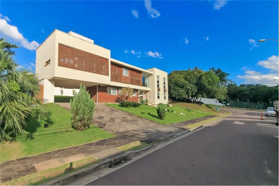 Foto 2 de Casa com 4 quartos à venda, 309m2 em Vila Nova, Porto Alegre - RS