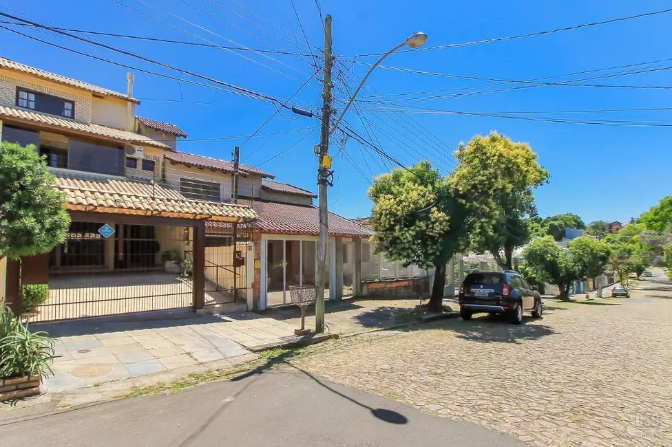 Foto 1 de Casa com 3 quartos à venda, 198m2 em Cavalhada, Porto Alegre - RS